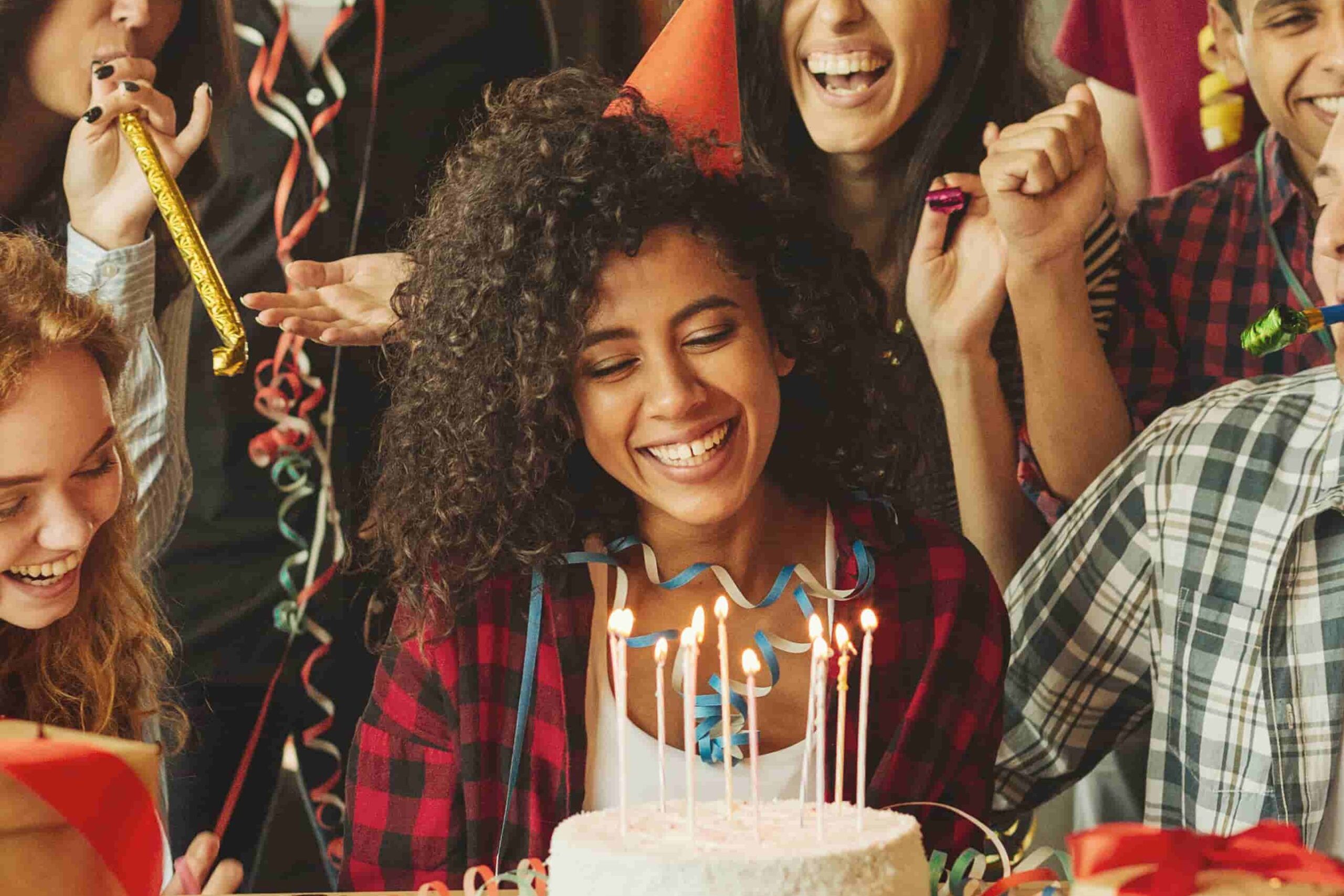 Friends having fun at birthday party Portrait of happy friends celebrating afro-american girl's birthday